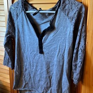 Grey shirt with black accent and three quarter length lace sleeves